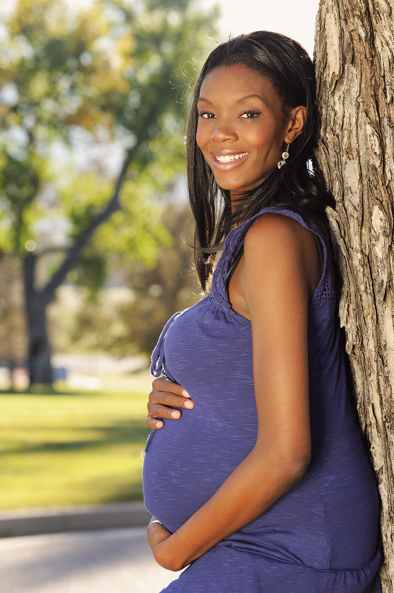 Woman reflecting during pregnancy in a calm setting