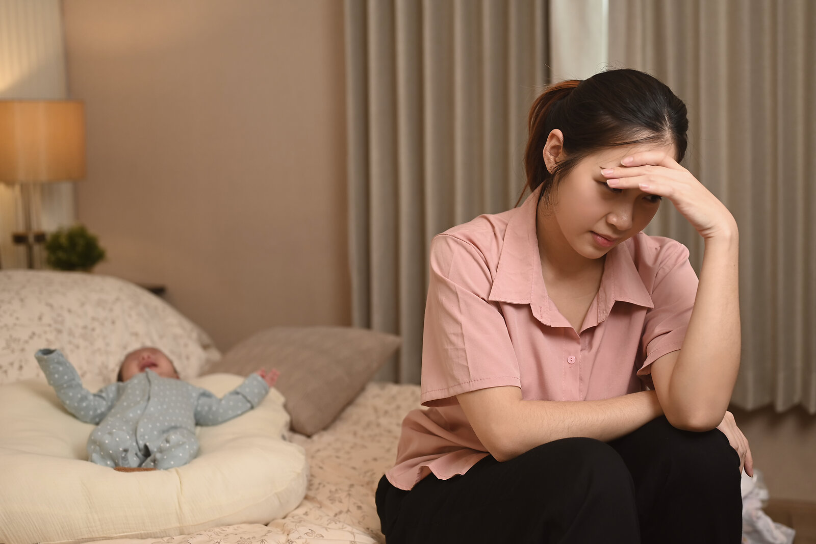 Mother experiencing postpartum depression in early motherhood